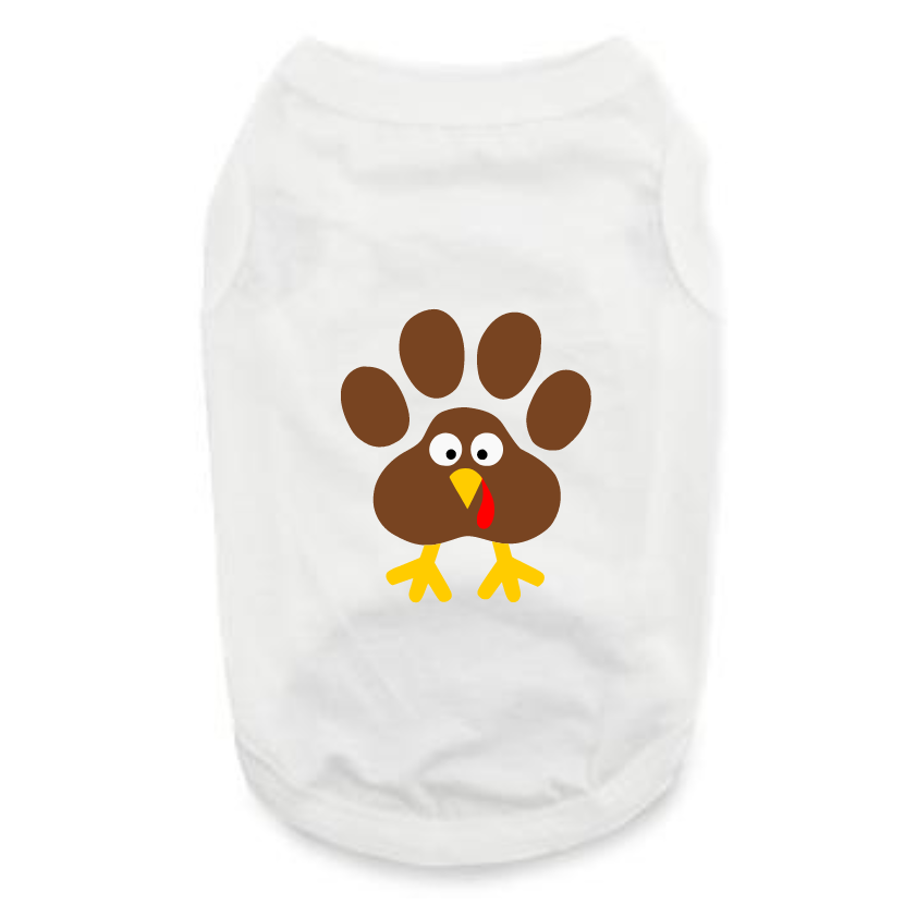The Thanksgiving Day- Turkey shirt is a white dog apparel featuring a cute turkey with a brown paw print as feathers, googly eyes, yellow beak and feet—ideal festive wear for your pet this Thanksgiving!.